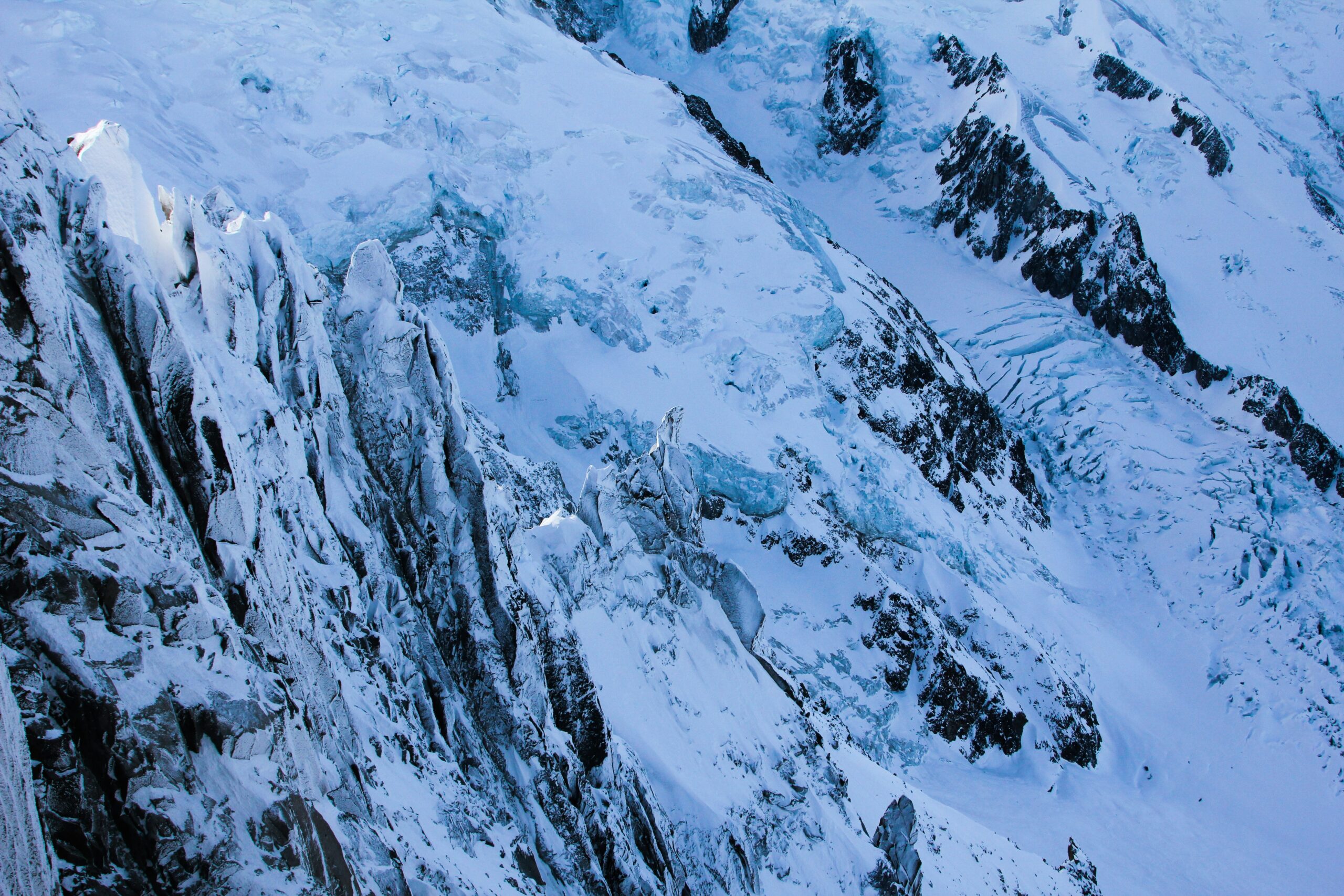 A climber using a Petzl GriGri at an outdoor crag