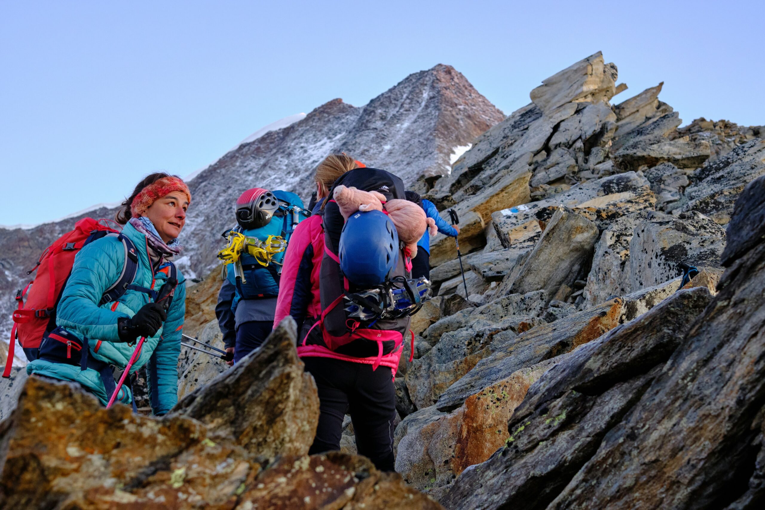 Group of climbers celebrating at the summit after successful ascent