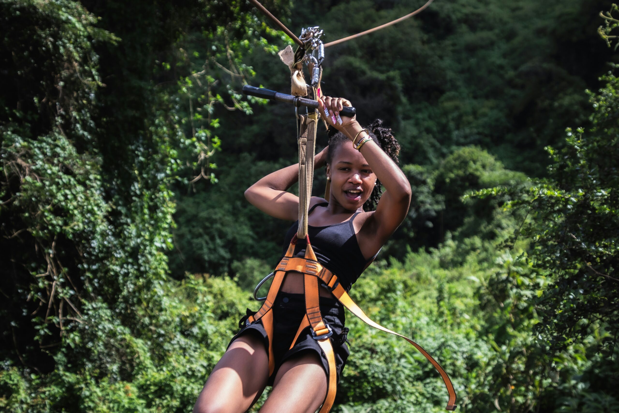 Sarah smiling after successfully completing her climb