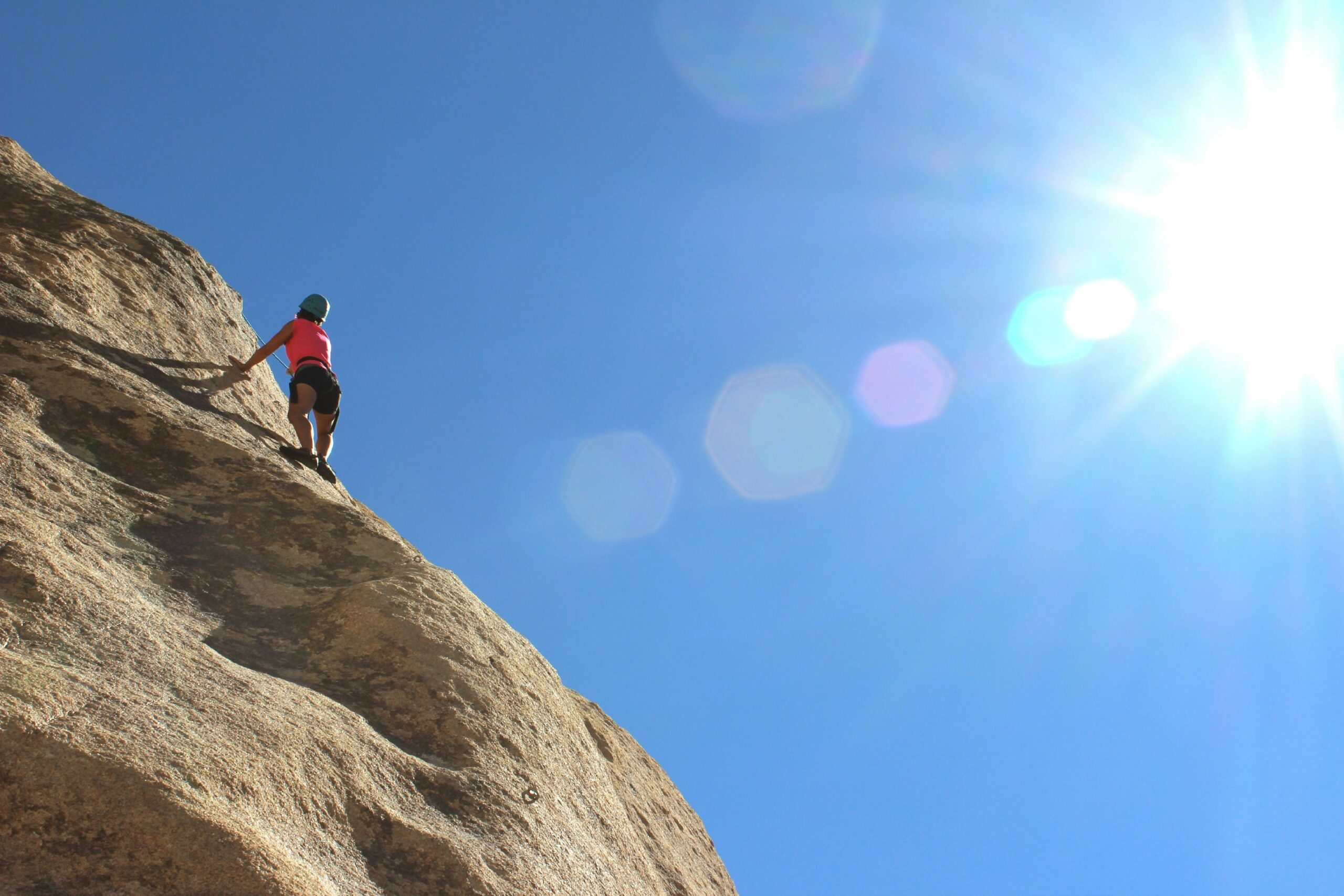 Climbers testing a belay device at a store