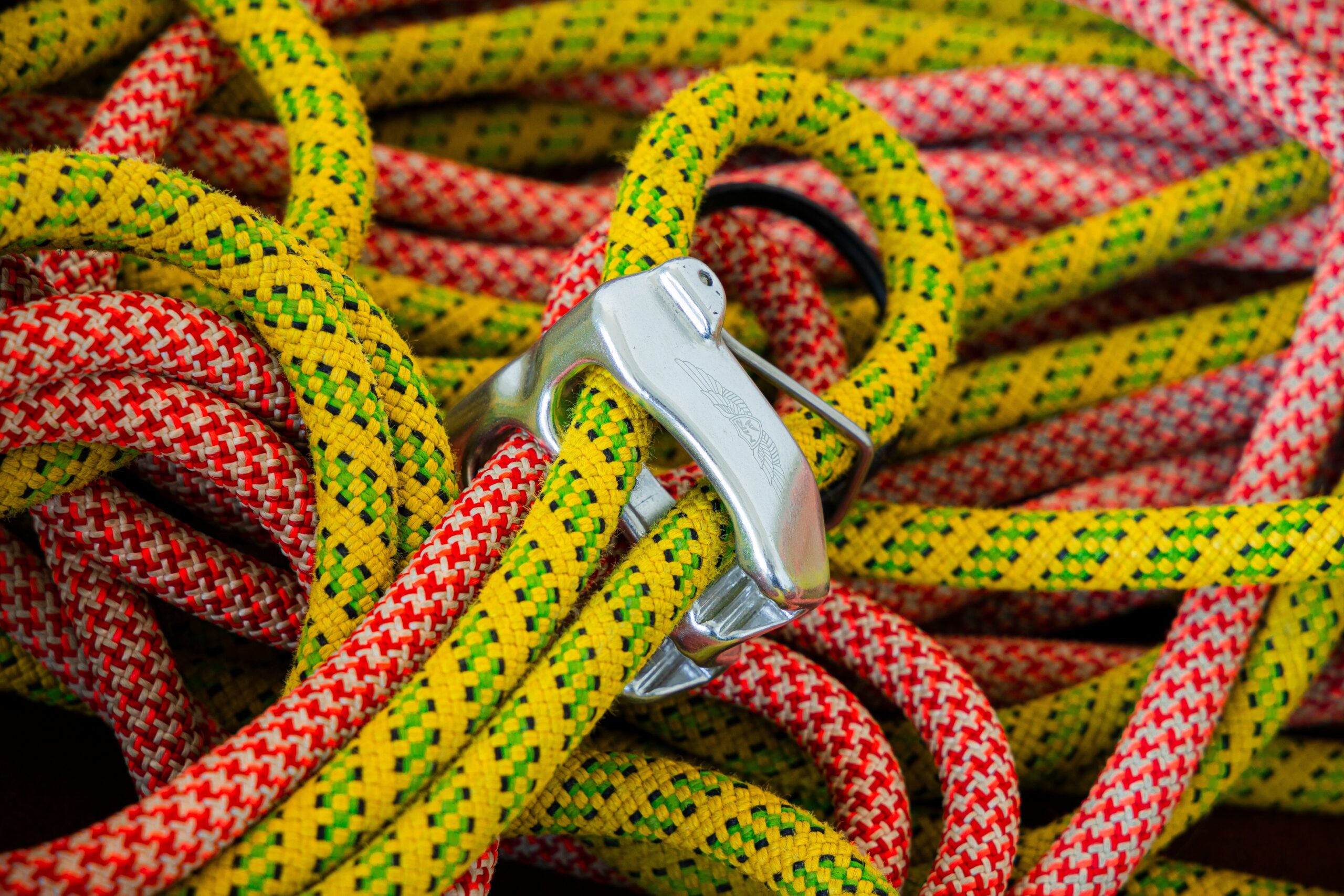 Close-up of a heavily worn climbing rope showing frayed fibers