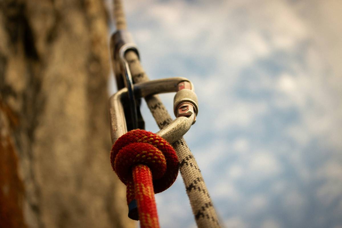 Close-up of a modern belay device used by climbers