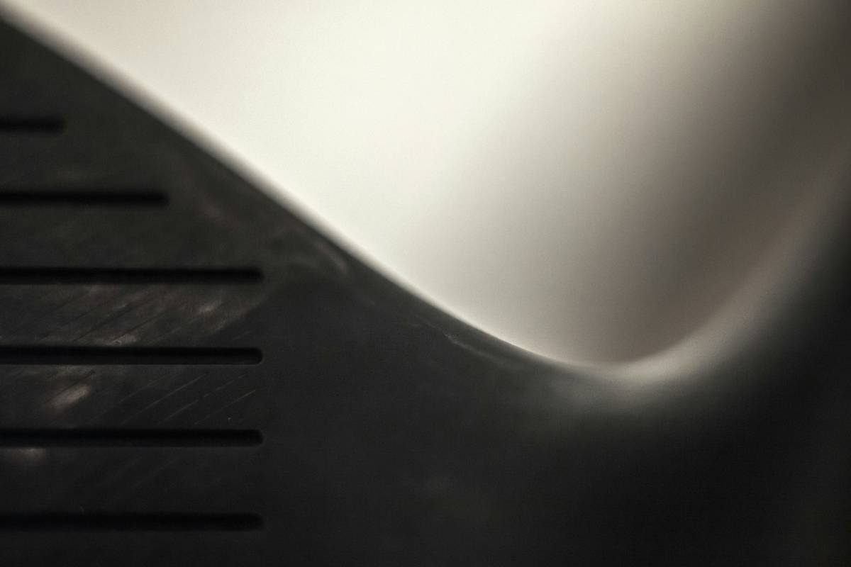 Climber using a black assisted-braking belay device on a rope.