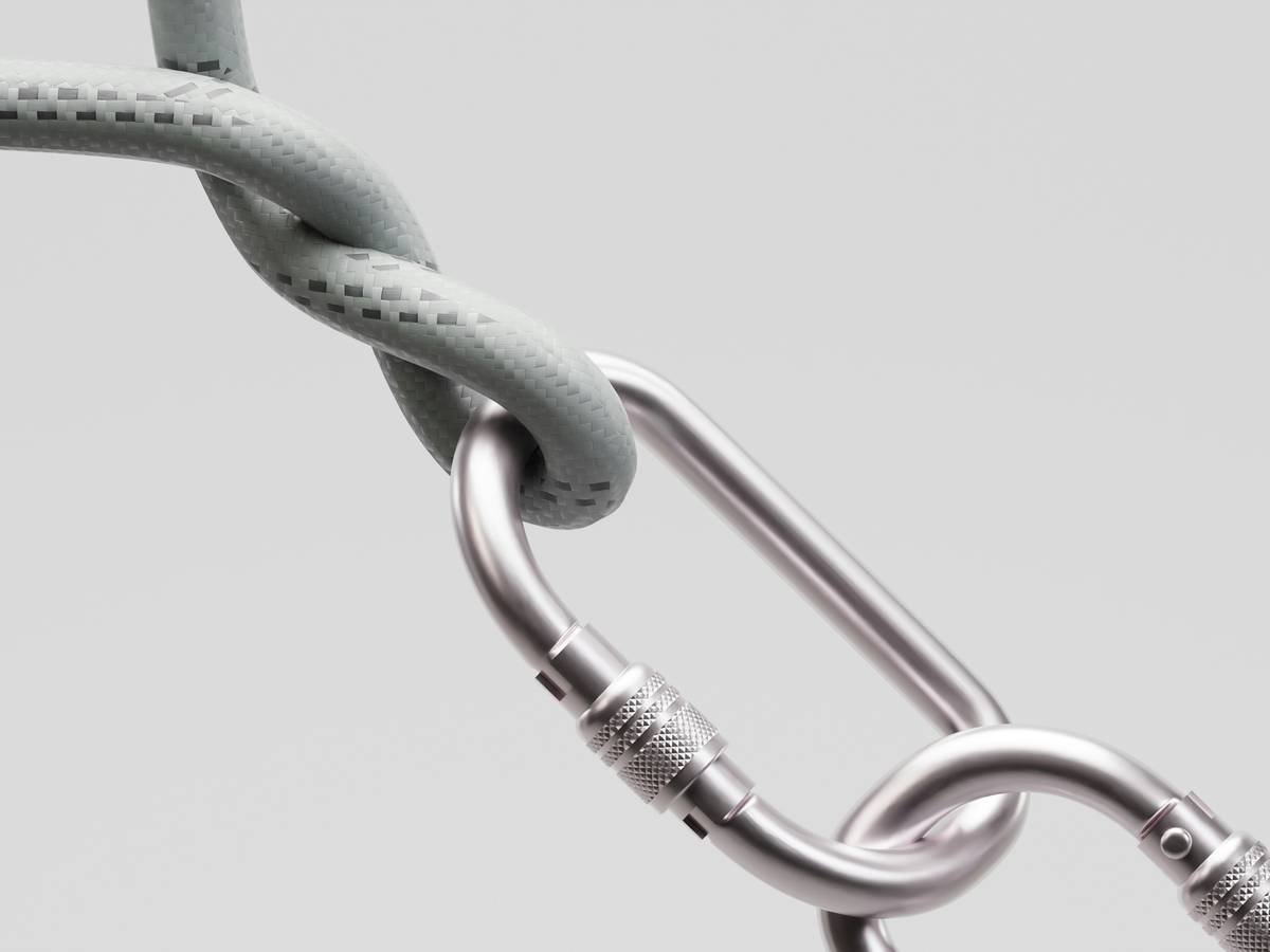 Close-up of a high-quality assisted braking belay device with ropes threaded correctly
